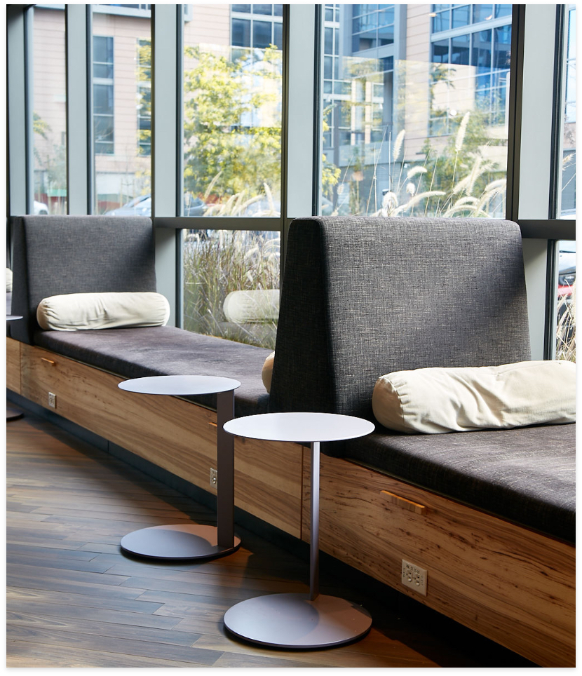 clothed seating benches with round end tables